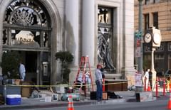 debris, clock, entrance, and temporary street signs