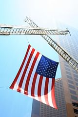 flag hanging from fire trucks