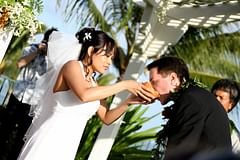groom drinking from coconut