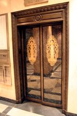 reflection on foshay tower elevator door