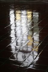 window reflection on ticket lobby floor