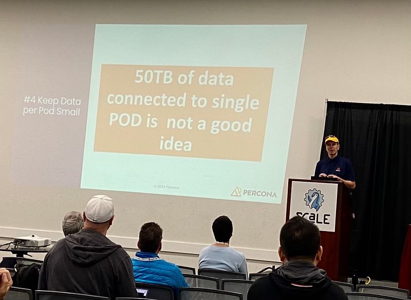 Peter Zaitsev, on the right, speaking at SCALE 21x. The slide reads: “#4 Keep Data per Pod Small / 50TB of data connected to a single POD is not a good idea.”